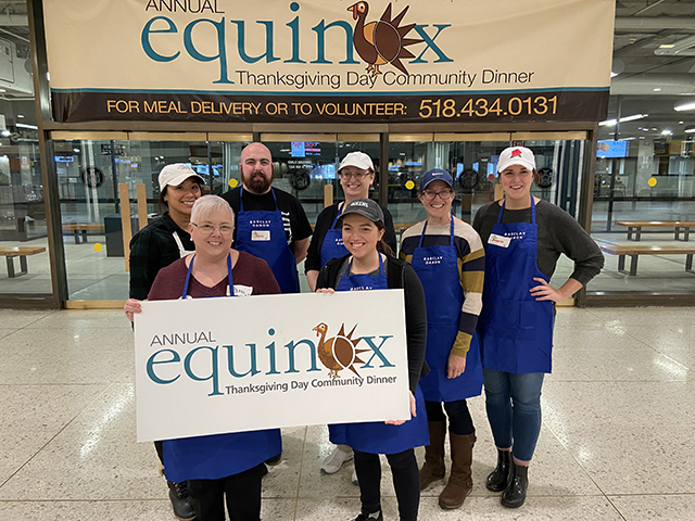 Albany attorneys and staff who volunteered to help Equinox sort and organize ingredients for thousands of meals for its annual Thanksgiving Day community dinner. 