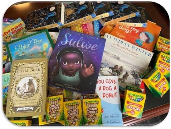 EnCompass Book Fairies Program: In May, the Rochester office participated in the EnCompass: Resources for Learning Book Fairies program. The goal was to place books and other literacy-related goodies into the hands of 500 elementary students in the city of Rochester.
