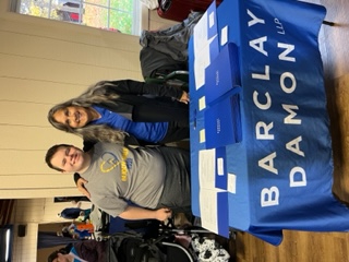 Lisa Arrington attended the Flower City Down Syndrome Network’s event Buddy Walk and shared information about the firm. Lisa is shown here with legal assistant Georgia Streeter’s  son Quentin.