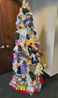 The Buffalo Diversity Leadership Team sponsored its “Share the Warmth Mitten, Hat, and Scarf Drive” for the benefit of Buffalo Public School #45, also known as the International School. Colleagues brought in items to donate, which they hung on a “giving tree,” shown in the photo, and also made monetary donations to the drive.